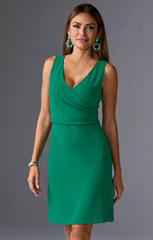 Model is wearing v-neck short green dress